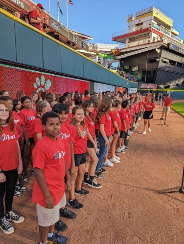 Middle school choirs perform at Reds game